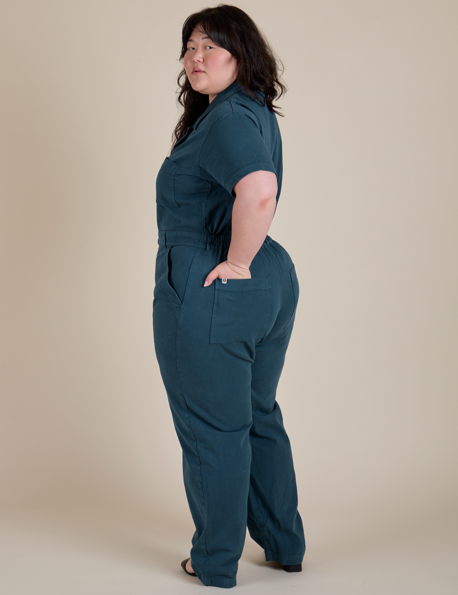 Angled back view of Short Sleeve Jumpsuit in Lagoon on Ashley