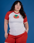 Ashley is 5’7” and wearing XL Produce Raglan Tee in Tomato