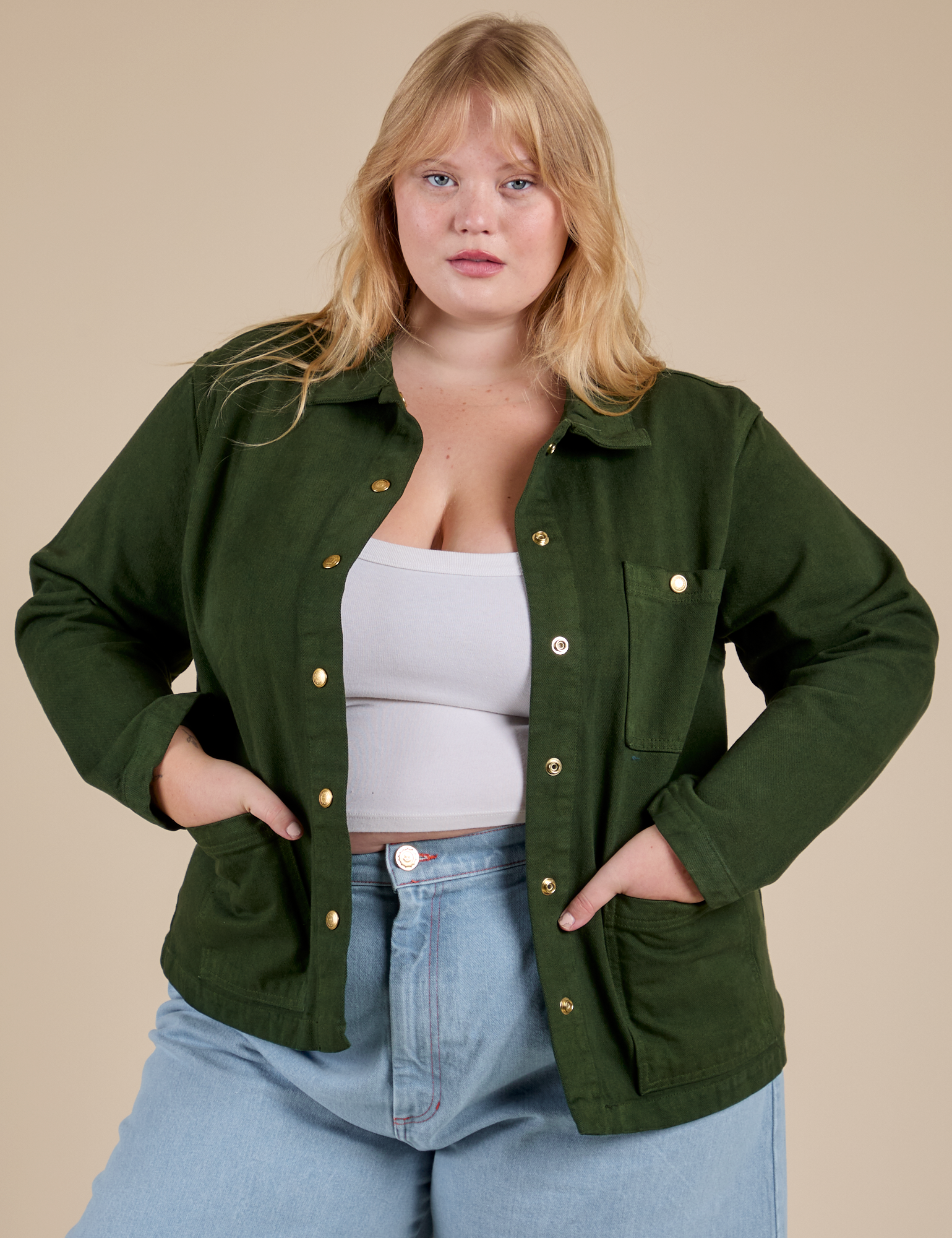 Juliet is 5'8" and wearing L Denim Work Jacket in Evergreen