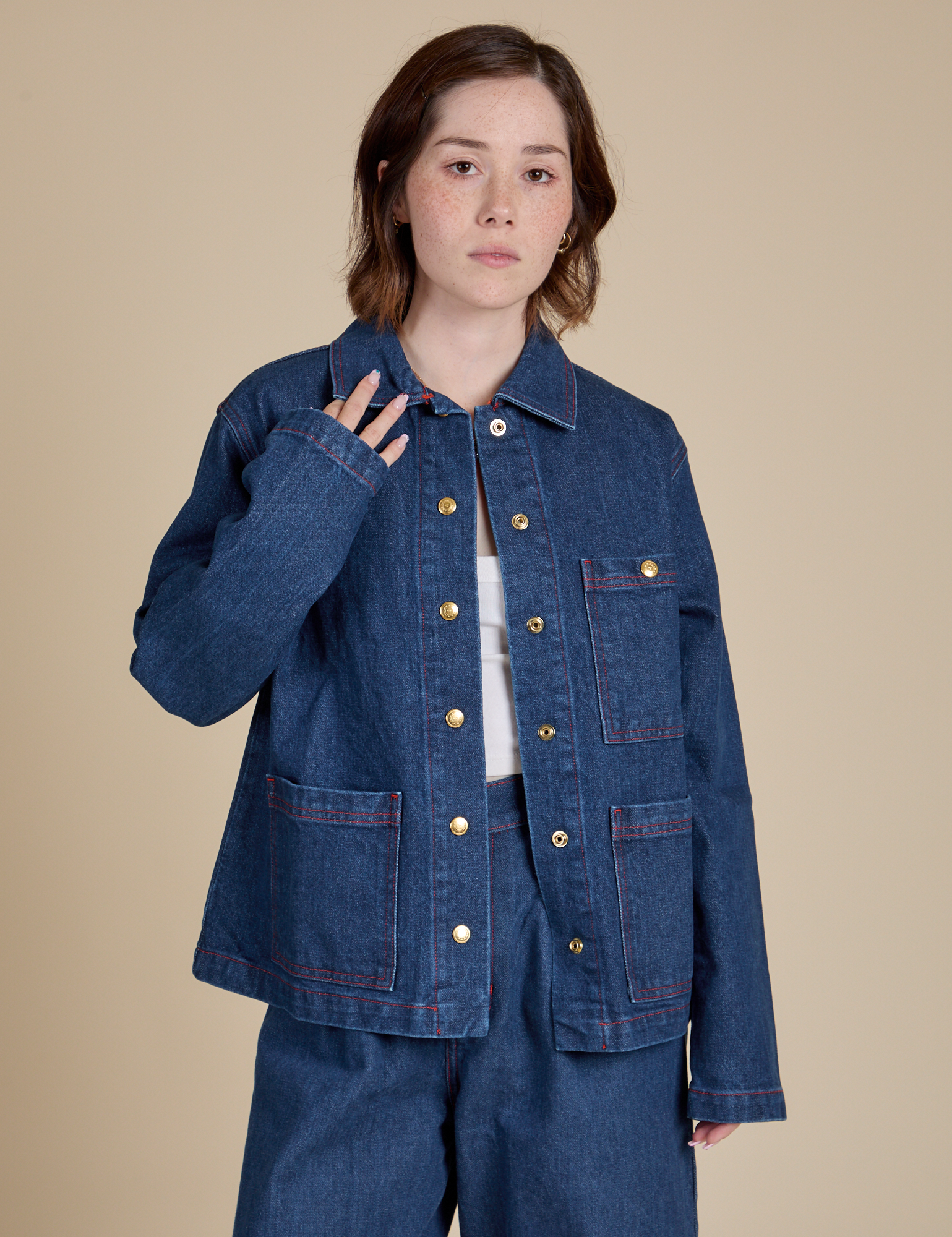 Hana is 5'3" and wearing P Indigo Denim Work Jacket in Dark Wash