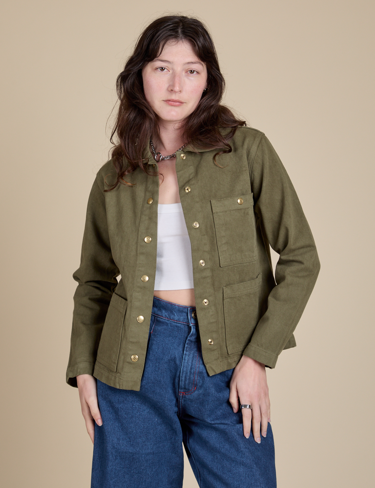 Alex is 5'8" and wearing P Denim Work Jacket in Surplus Green