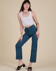Alex is wearing Work Pants in Lagoon and vintage tee white Cropped Tank