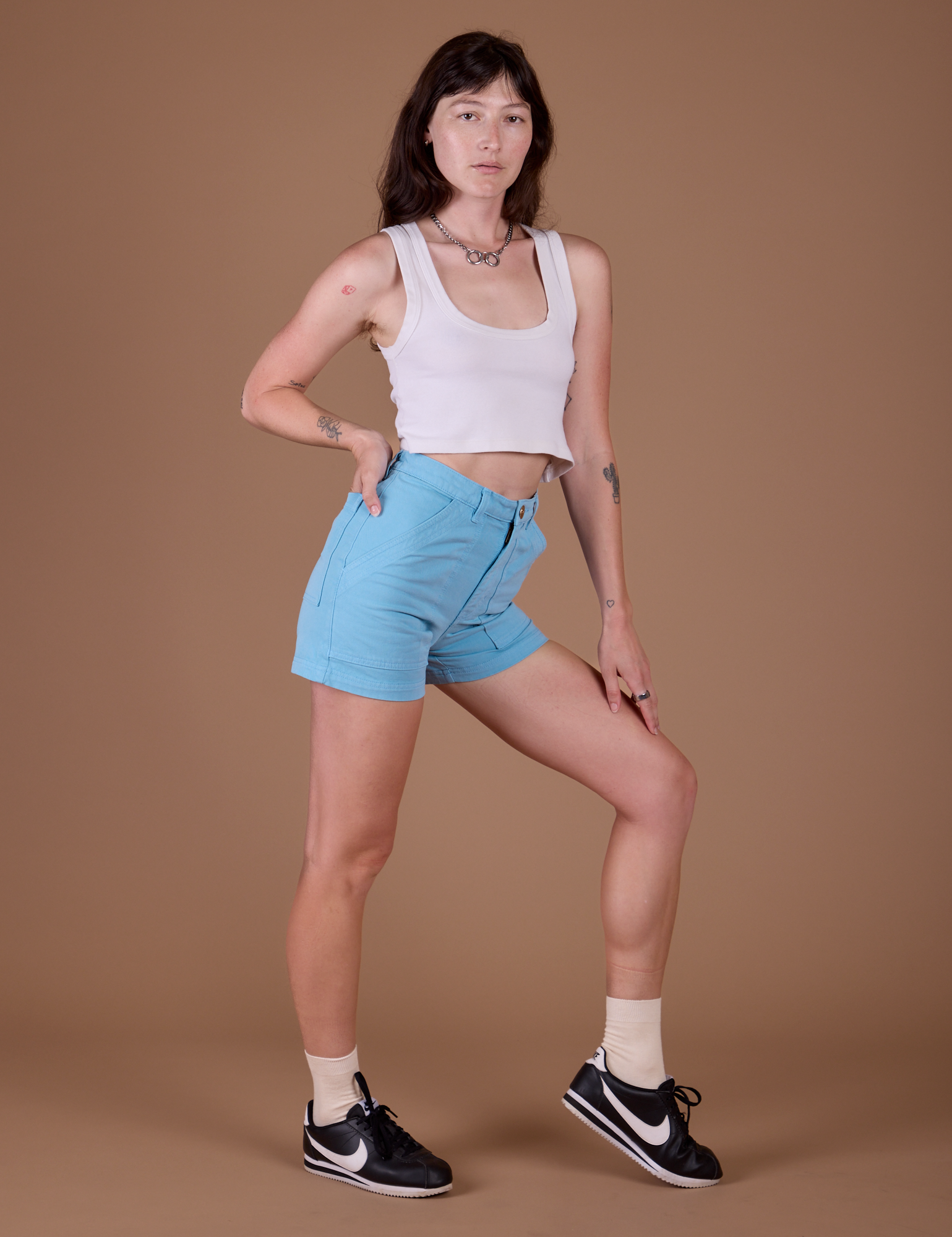Angled front view of Classic Work Shorts in Baby Blue and Cropped Tank in Vintage Off White on Alex