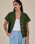 Anthony is 5’6” and wearing S Pantry Button-Up in Evergreen