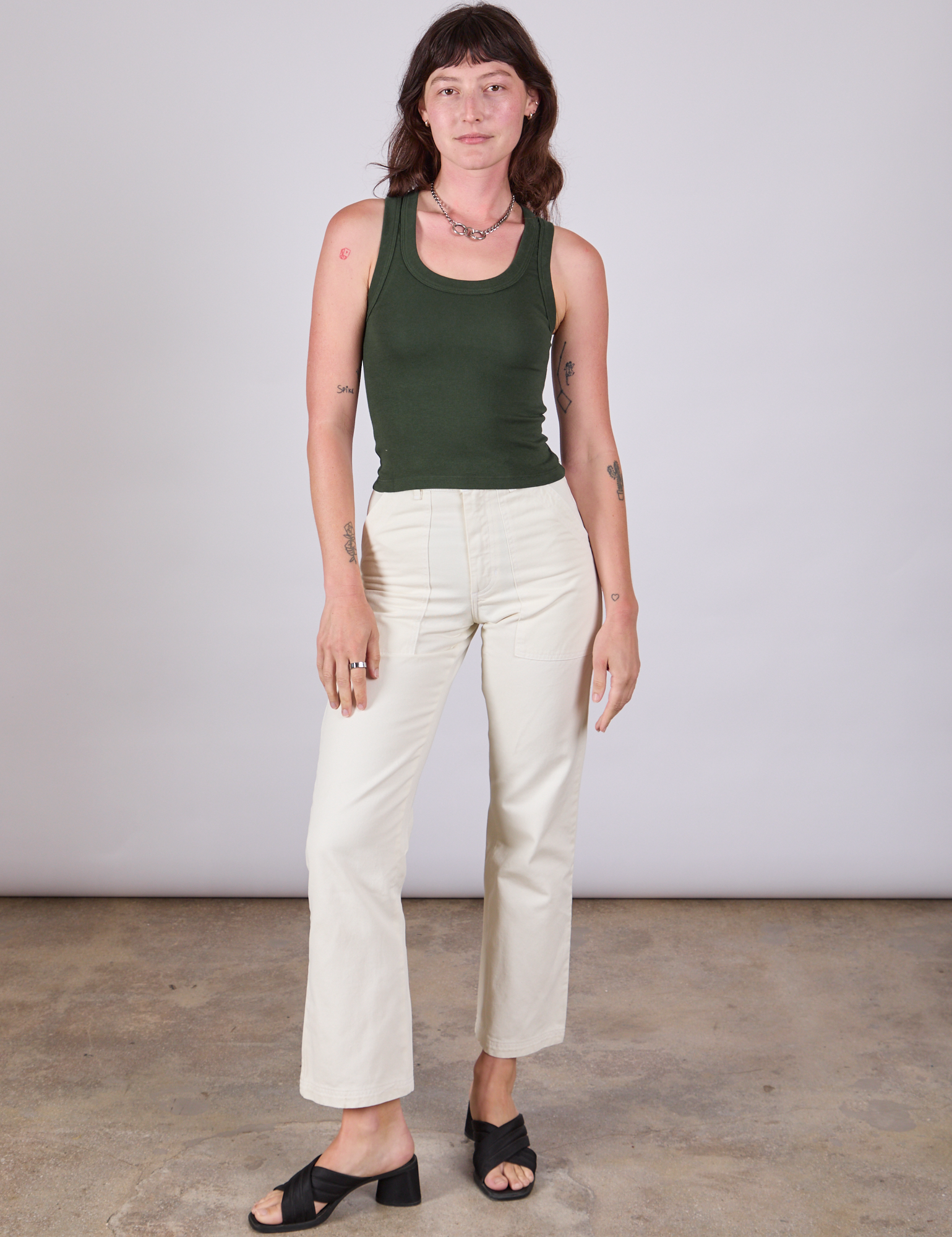 Alex is wearing Tank Top in Swamp Green and vintage tee off-white Work Pants