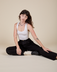 Heavyweight Trousers in Basic Black and vintage tee white Cropped Tank worn by Alex