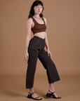 Side view of Work Pants in Espresso Brown and fudgesicle brown Mini Tank on Alex