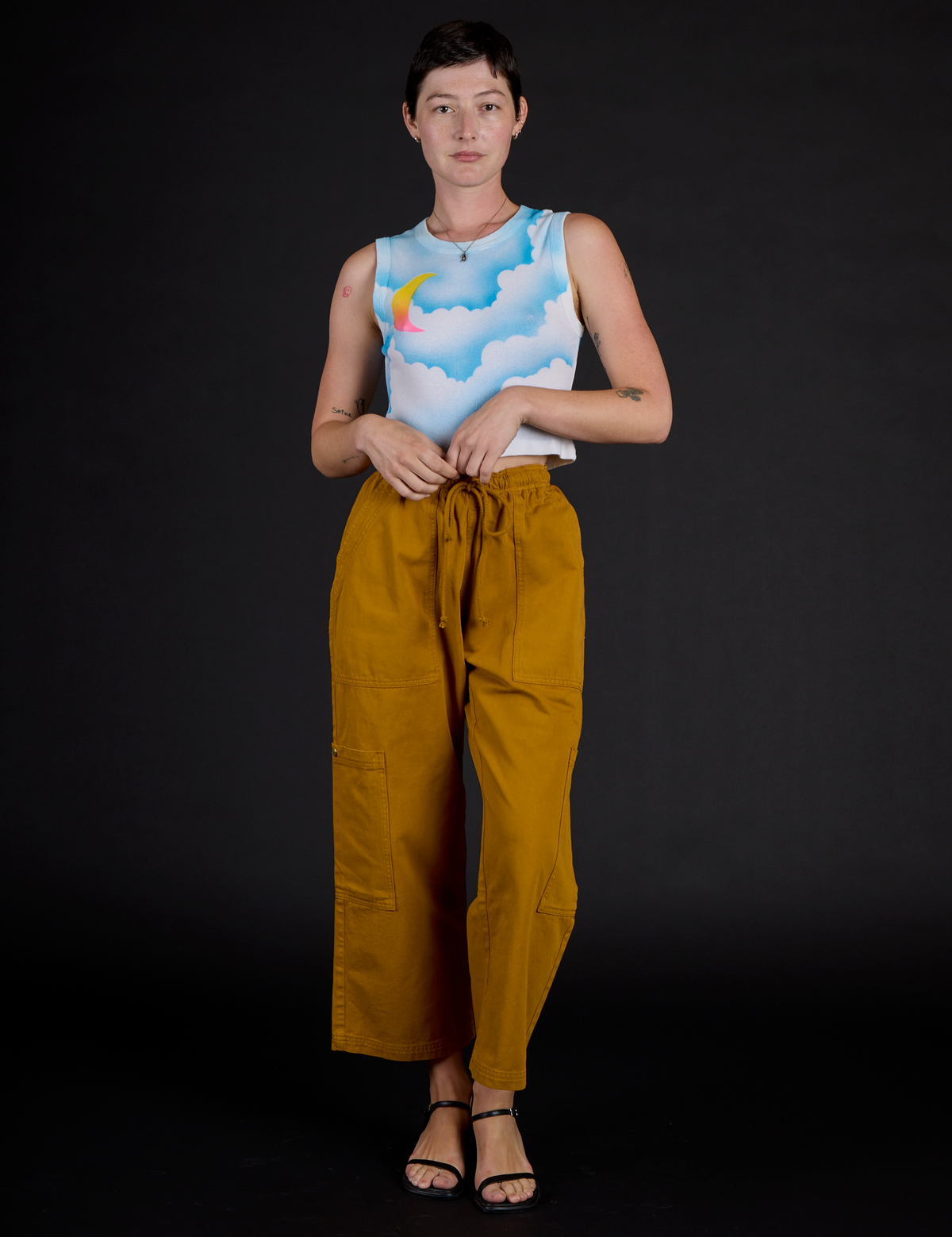 Alex wearing the Morning Moon Airbrush Muscle Tee with Spicy Mustard Drop Pocket Cargo Pants