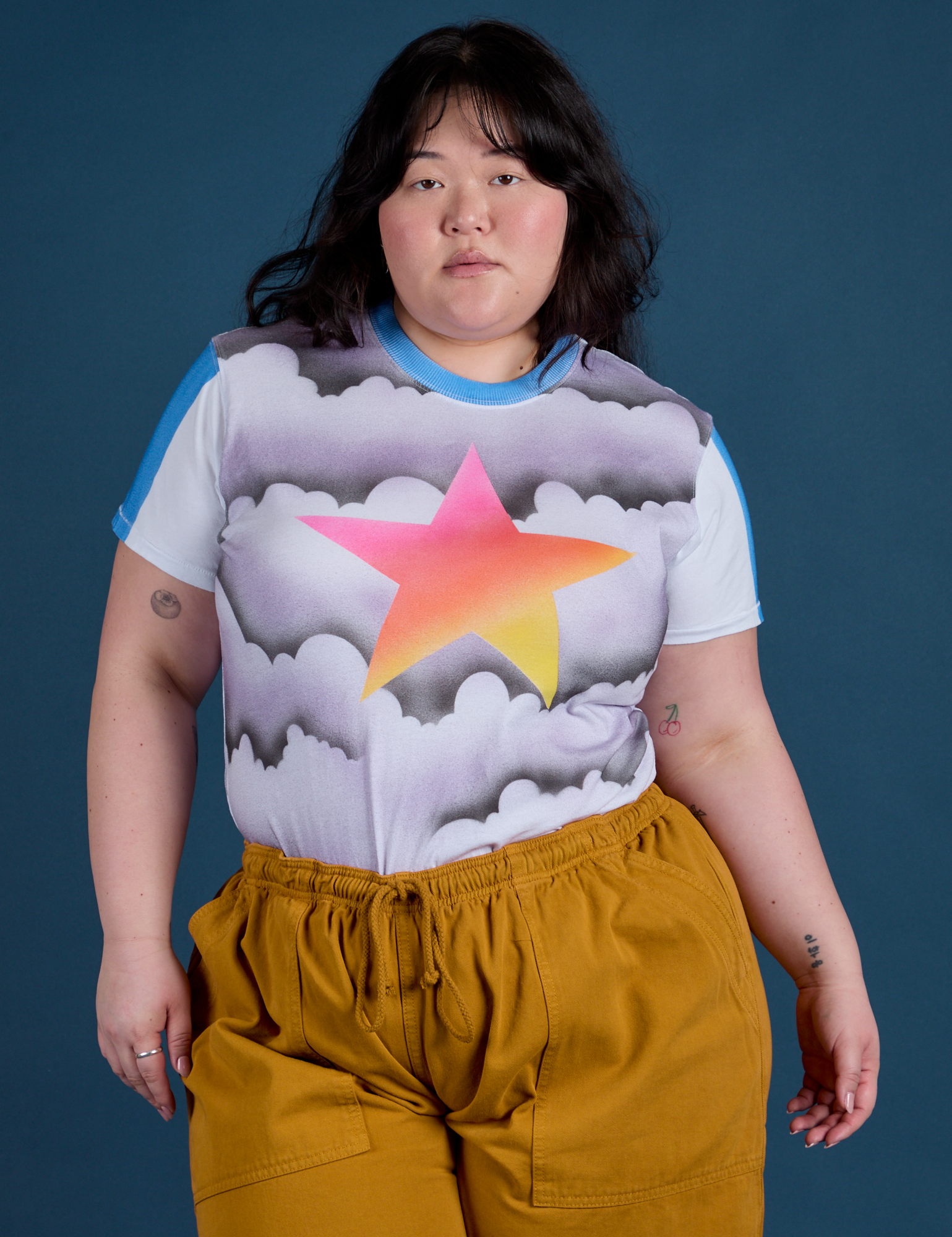 Ashley is wearing Airbrush Star Vintage Tee tucked into spicy mustard Drop Pocket Cargo Pants