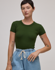 Alex is 5'8" and wearing P Baby Tee in Evergreen