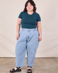 Ashley is wearing Baby Tee in Lagoon with light wash Denim Trousers