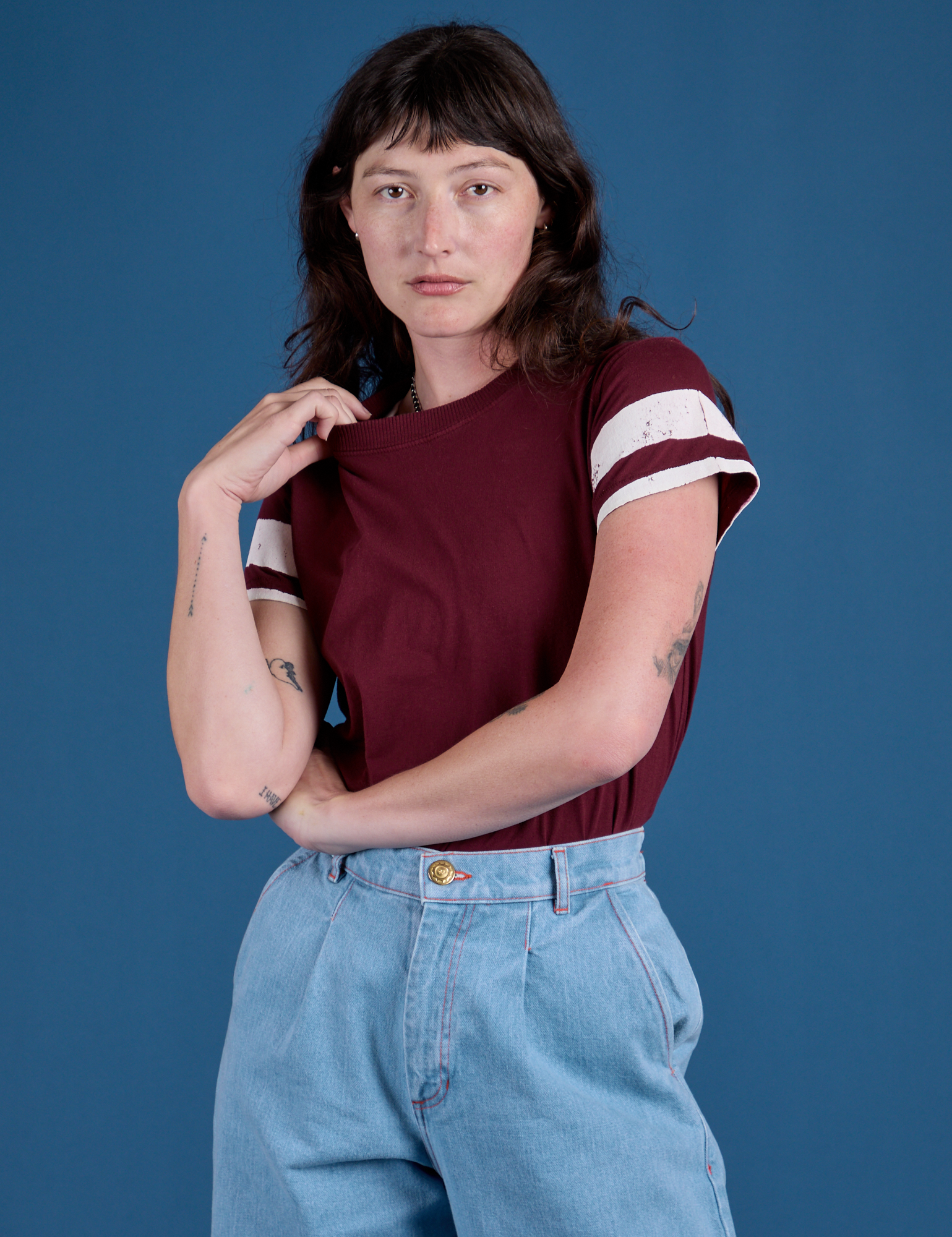 Alex is 5’8” and wearing P Painted Vintage Tee in Red Wine
