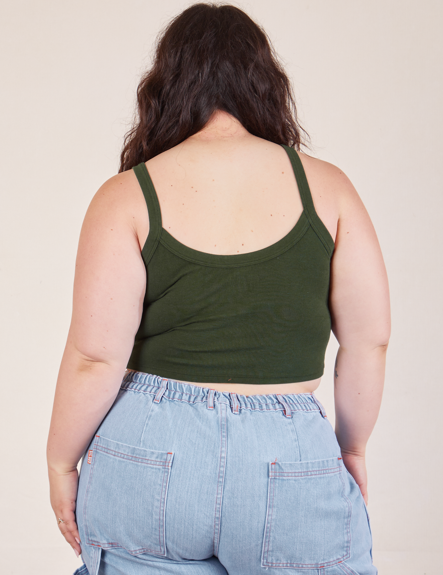 Cropped Cami in Swamp Green and light wash Carpenter Jeans back view on Ashley