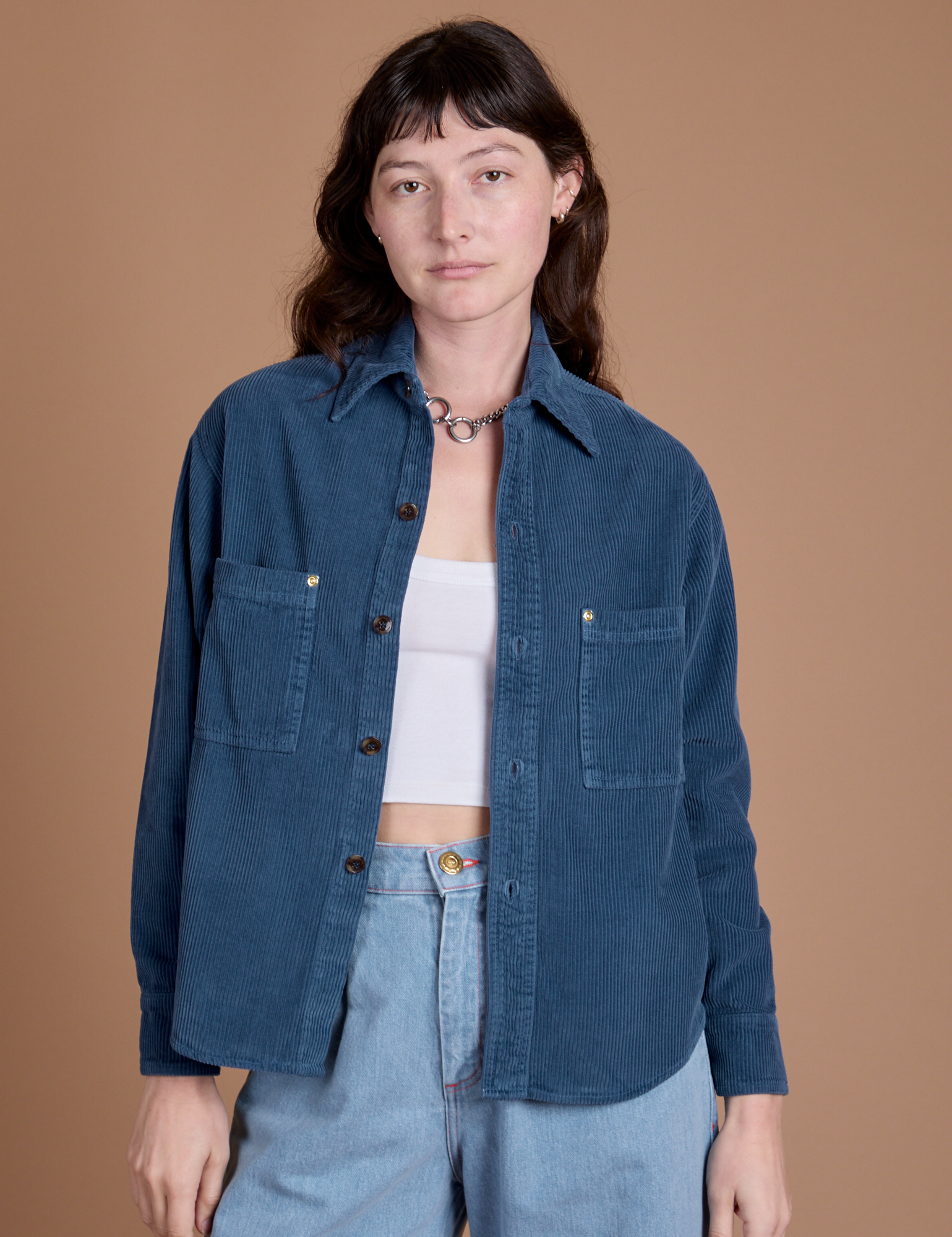 Alex is 5'8" and wearing P Cropped Corduroy Overshirt in French Blue