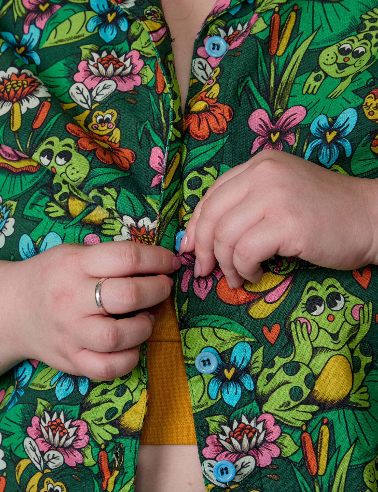 Close up of Ashley buttoning up the Pond Party Pantry Button-Up