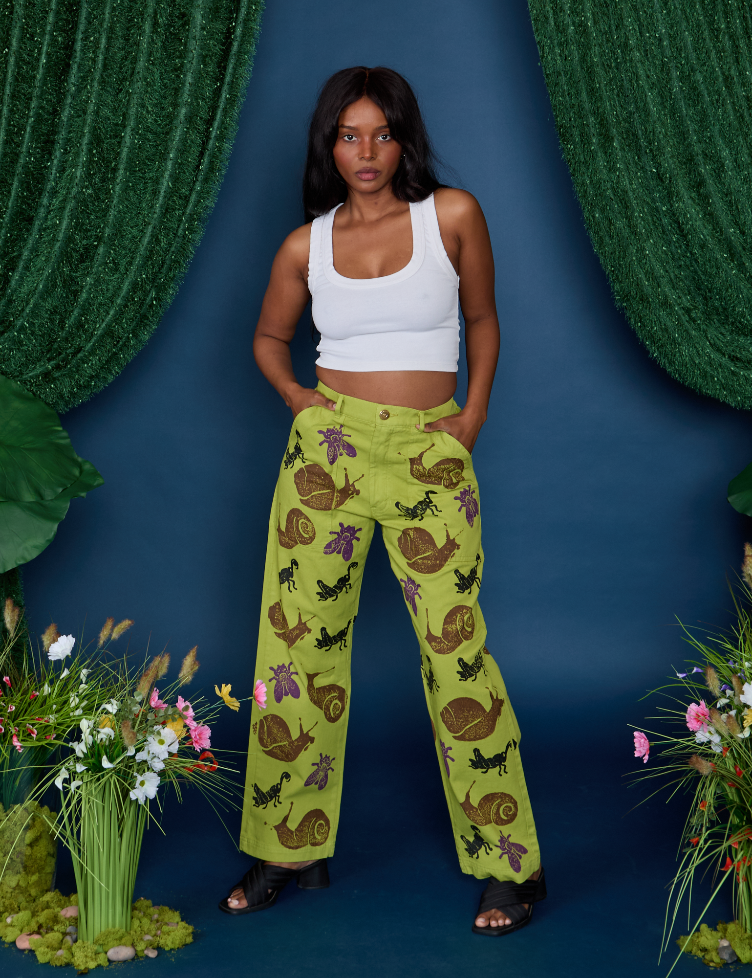 Kandia is wearing Paintstamped Work Pants in Froggy and vintage tee white Cropped tank