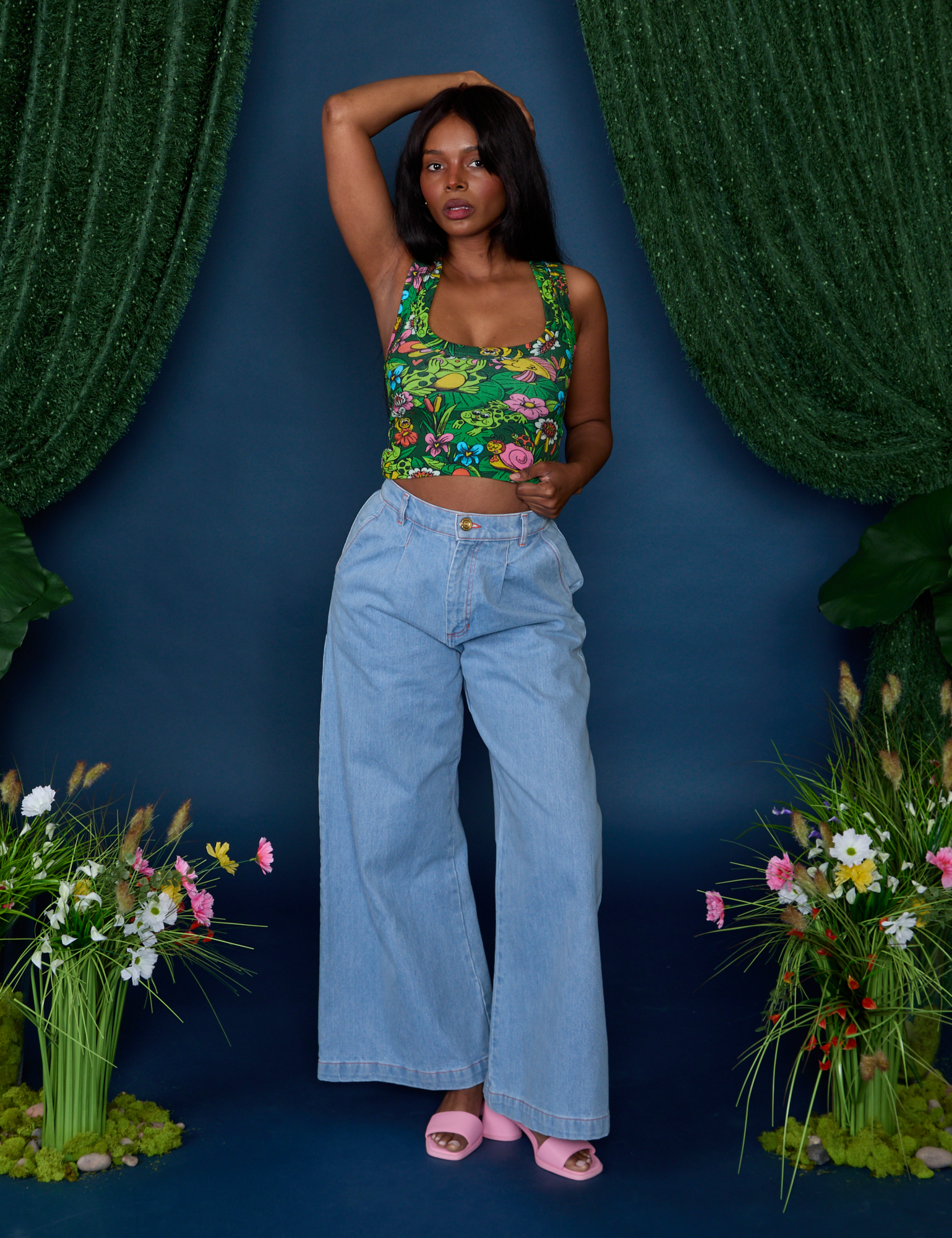 Kandia is wearing Cropped Tank Top in Pond Party and light wash Indigo Wide Leg Trousers
