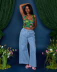 Kandia is wearing Cropped Tank Top in Pond Party and light wash Indigo Wide Leg Trousers