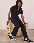 Jerrod is wearing Long Jumpsuit in Basic Black