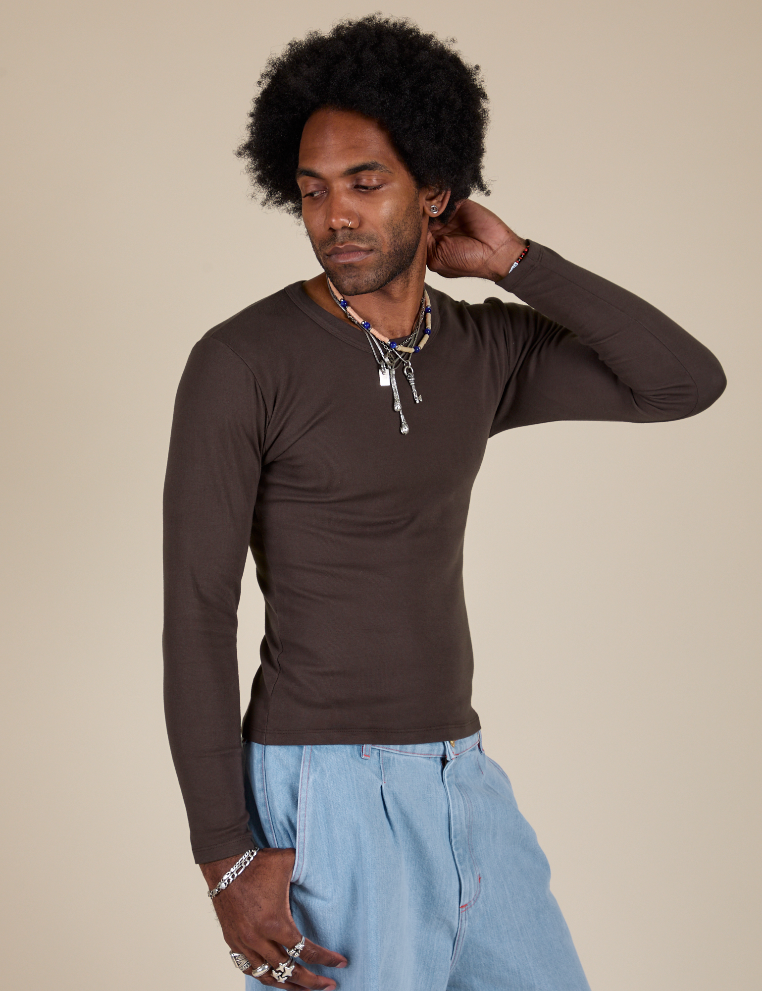 Jerrod is 6’3” and wearing S Long Sleeve Baby Tee in Espresso Brown