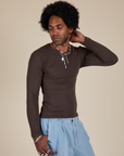 Jerrod is 6’3” and wearing S Long Sleeve Baby Tee in Espresso Brown