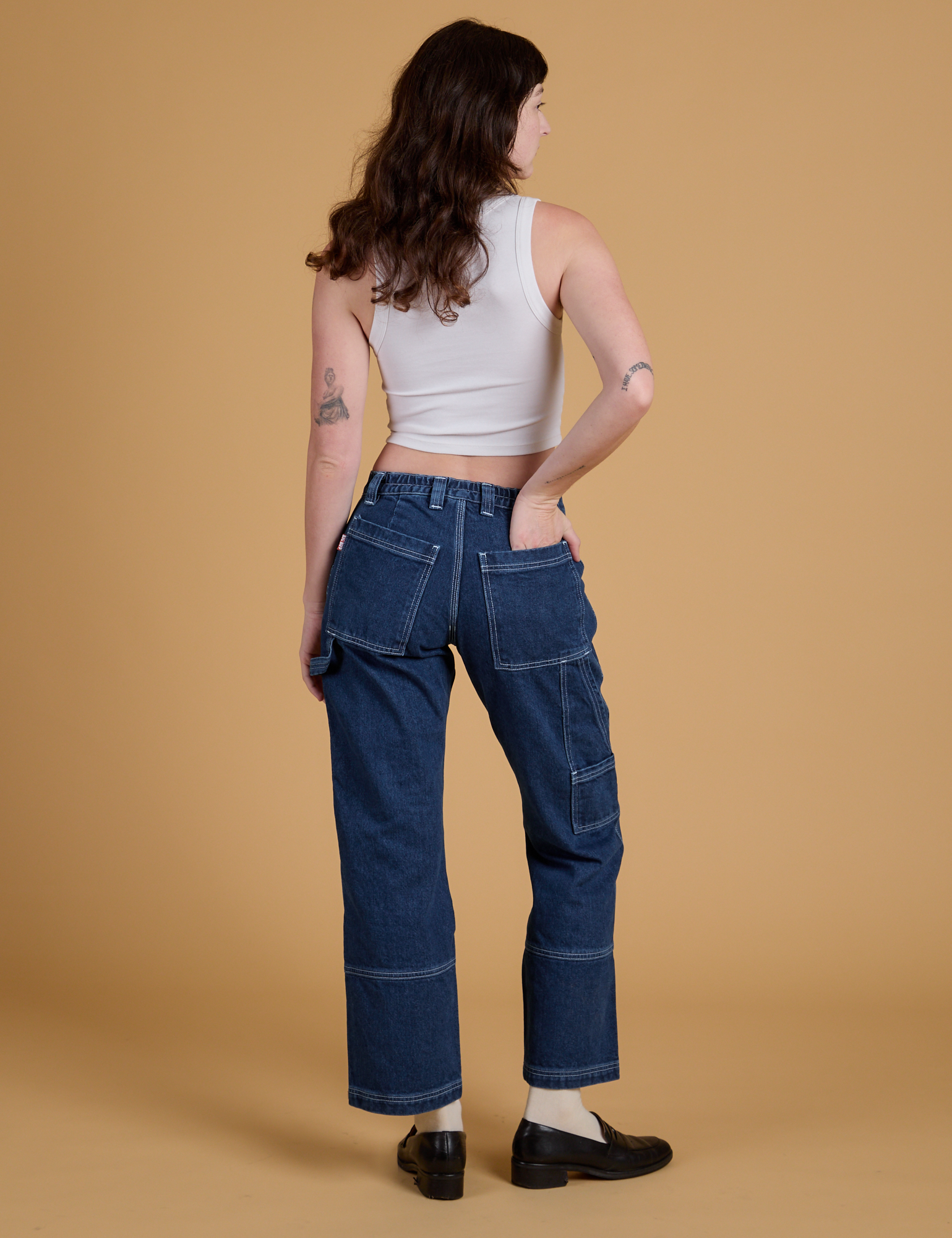 Mid-Rise Carpenter Jeans in Dark Wash back view on Alex