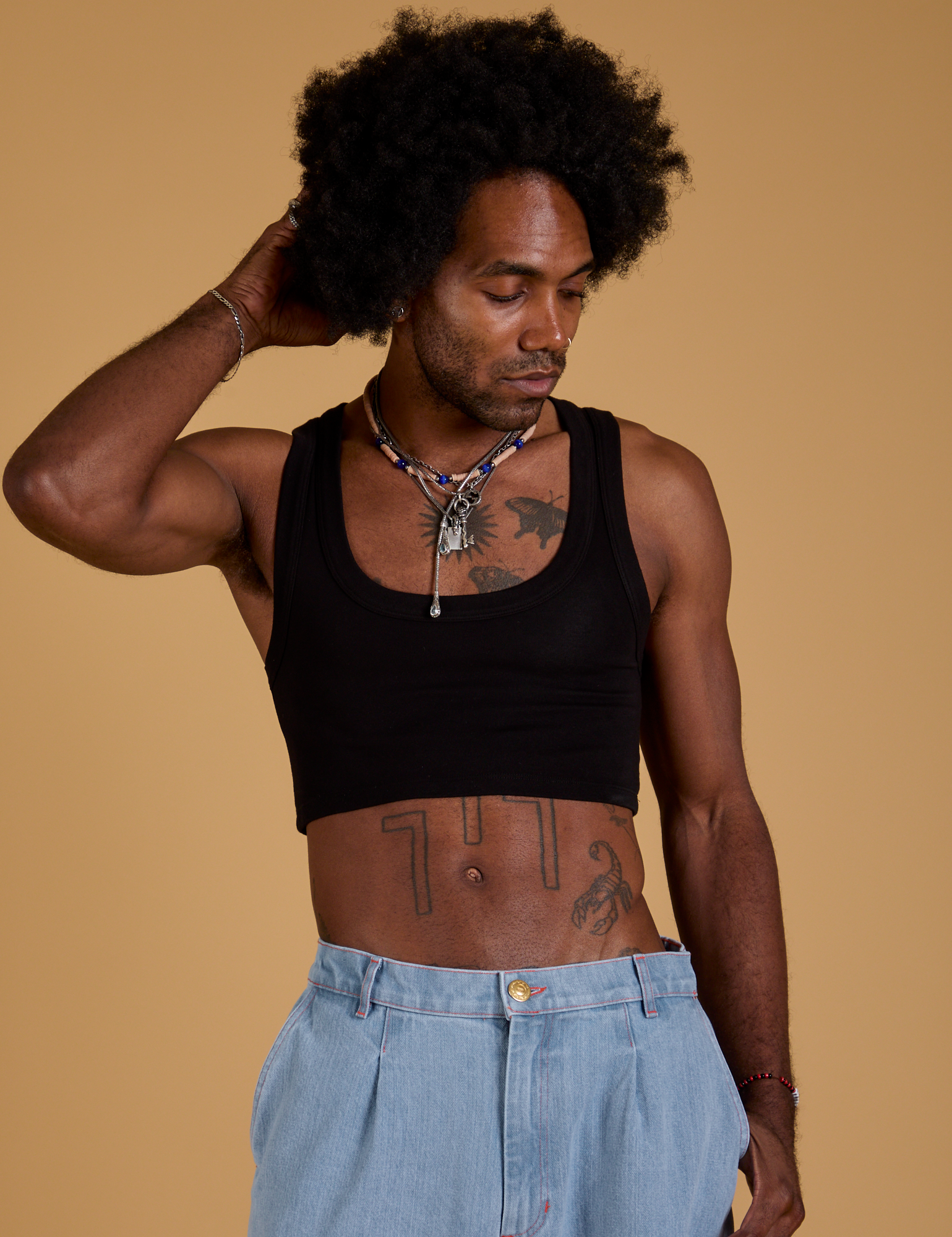 Jerrod is 6’3” and wearing S Mini Tank in Basic Black