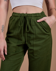 Organic Action Pants in Evergreen front close up on Alex