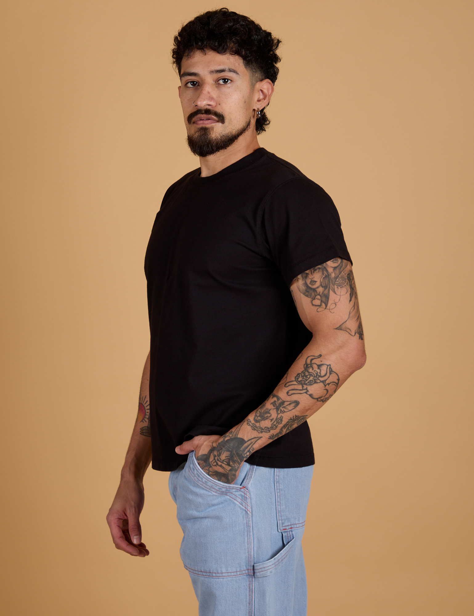 Angled front view of Organic Vintage Tee in Basic Black on Jesse