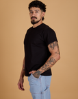 Angled front view of Organic Vintage Tee in Basic Black on Jesse