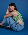 Alex is wearing  Deep-Cut Racerback Tank in Spring Quilt Print and light wash Denim Drop Pocket Cargo Pants