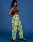 Side view of Drop Pocket Cargo Pants in Spring Quilt Print and evergreen Mini Tank on Kandia