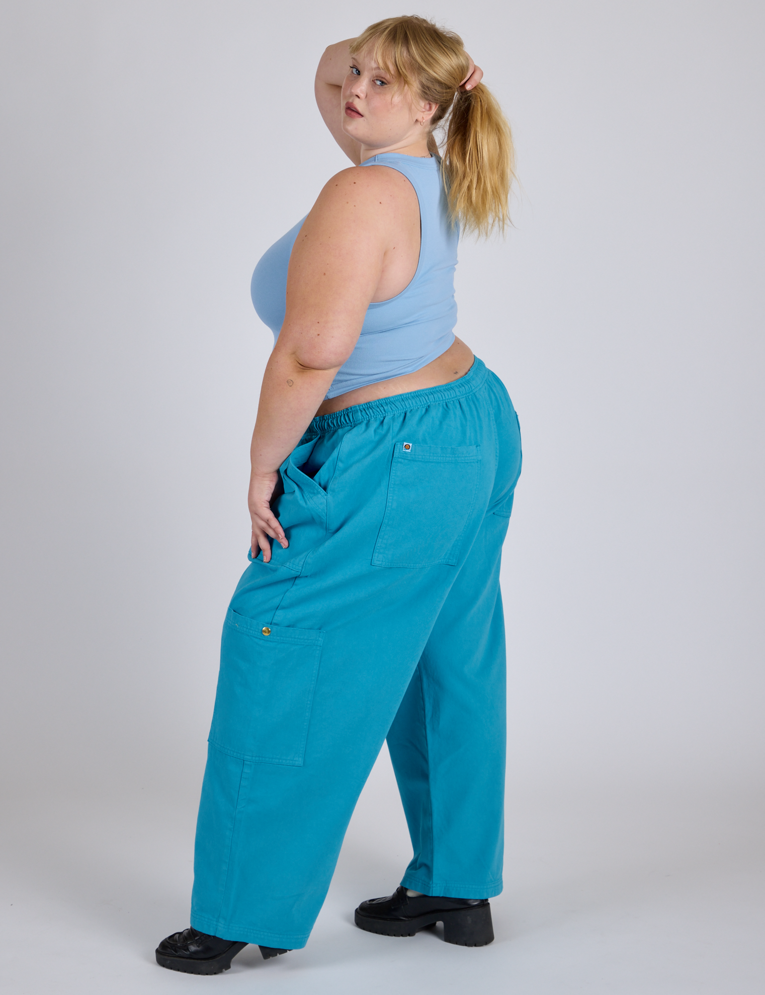 Side view of Drop Pocket Cargo Pants in Hawaiian Blue and baby blue Racerback Tank on Juliet