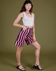 Angled front view of Longline Work Shorts in Bubblegum Pink and vintage tee white Cropped Tank on Alex