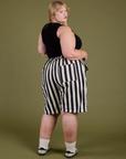 Longline Work Shorts in Natural angled back view on Juliet