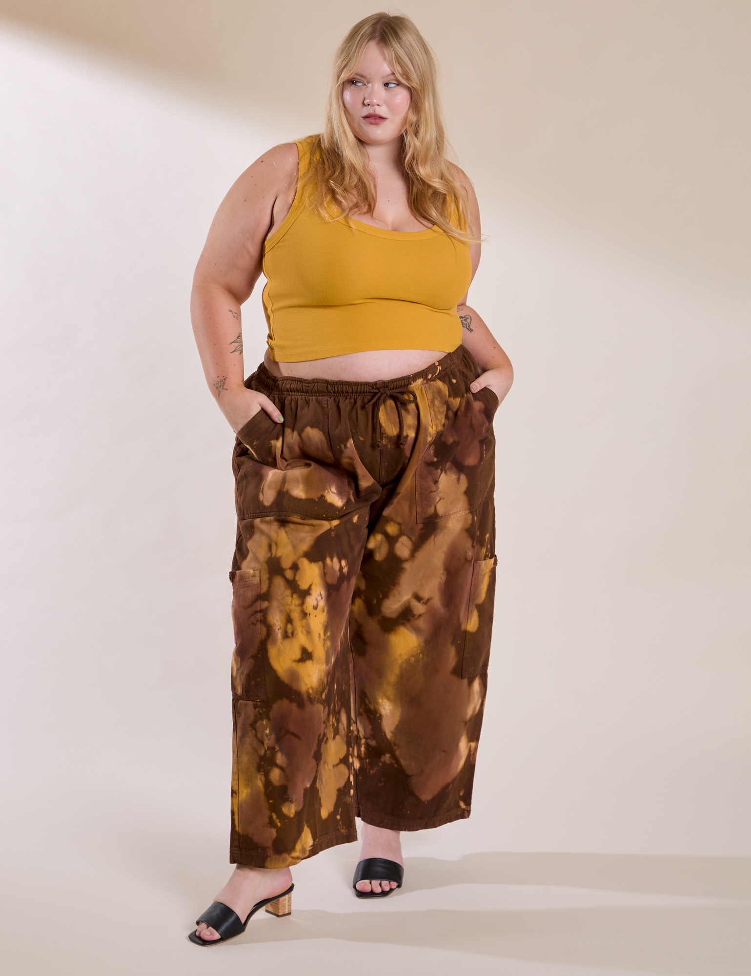 Juliet is wearing Magic Waters Drop Pocket Pants in Honey Brown and mustard yellow Cropped Tank