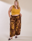 Juliet is wearing Magic Waters Drop Pocket Pants in Honey Brown and mustard yellow Cropped Tank