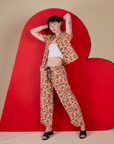Alex is wearing  Hot Stuff Drop Pocket Cargo Pants paired with matching Pantry Button-Up