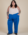 Sam is 5’10” and wearing 4XL Work Pants in Royal Blue paired with a vintage tee off-white Tank Top