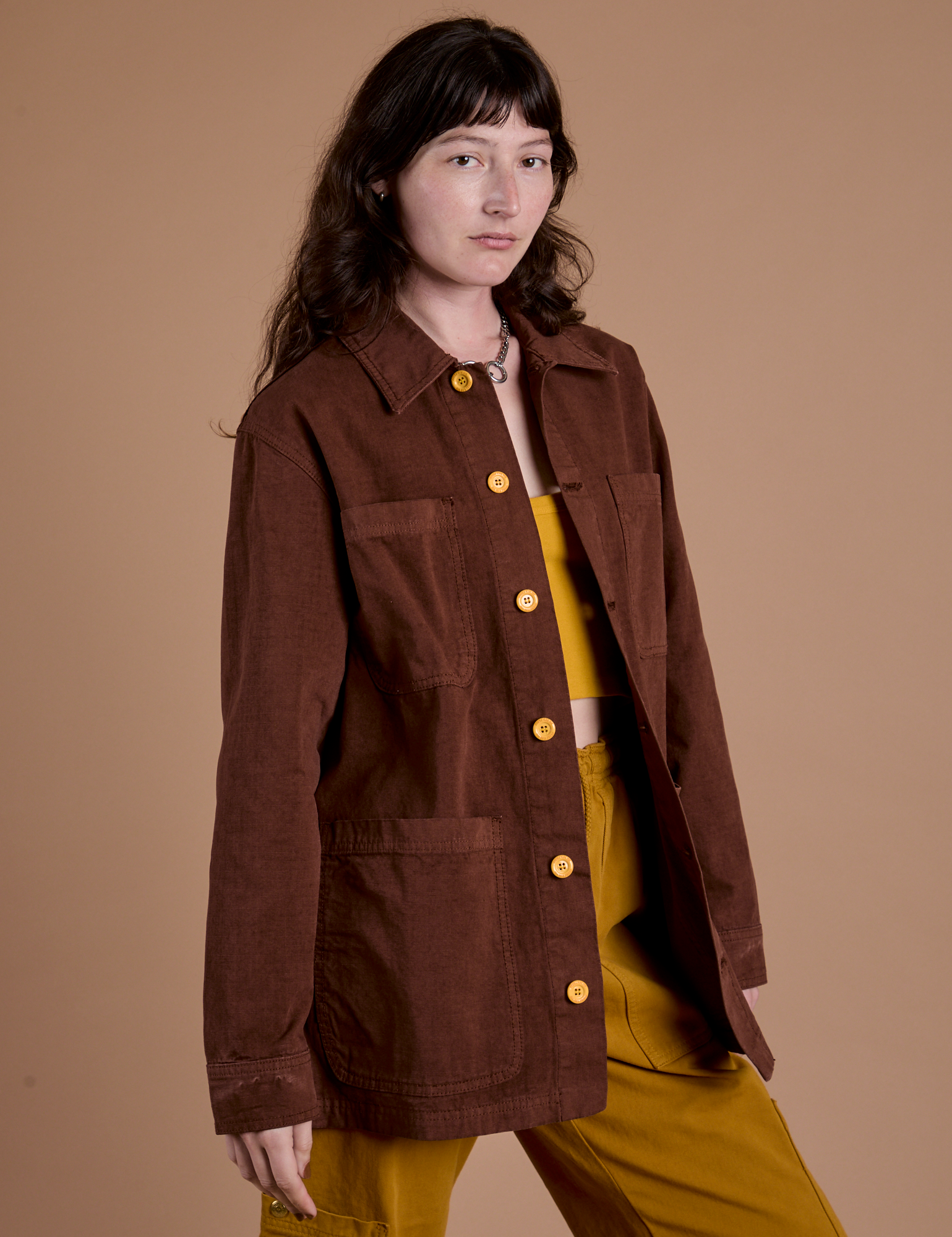 Front angled view of Ripstop Field Coat in Fudgesicle Brown on Alex