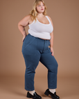 Angled front view of Organic Work Pants in French Blue and vintage tee white Cropped Tank on Juliet