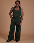 Demi is wearing Action Pants in Swamp Green and Tank Top in Swamp Green