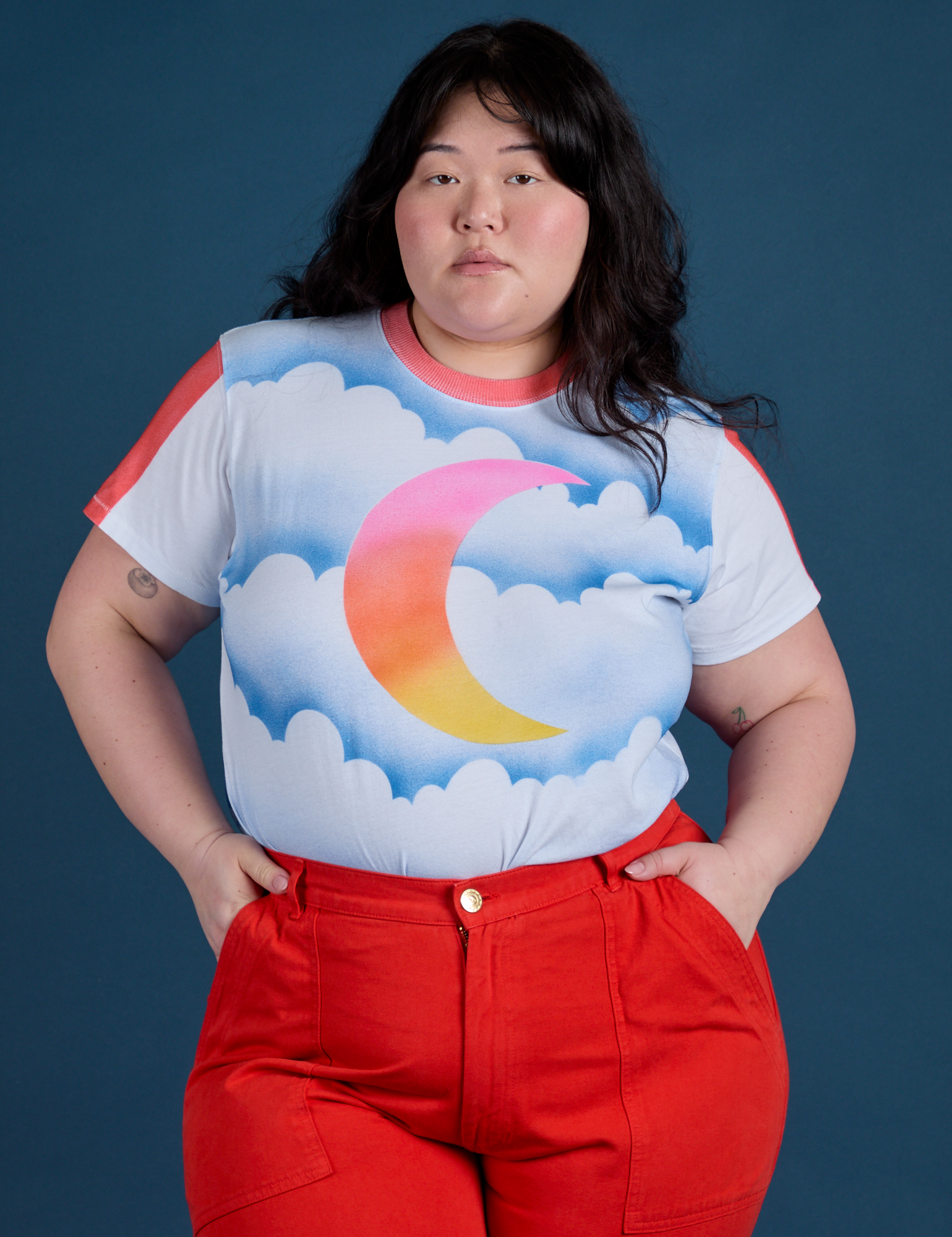 Ashley is wearing Airbrush Moon Vintage Tee tucked into mustang red Work Pants