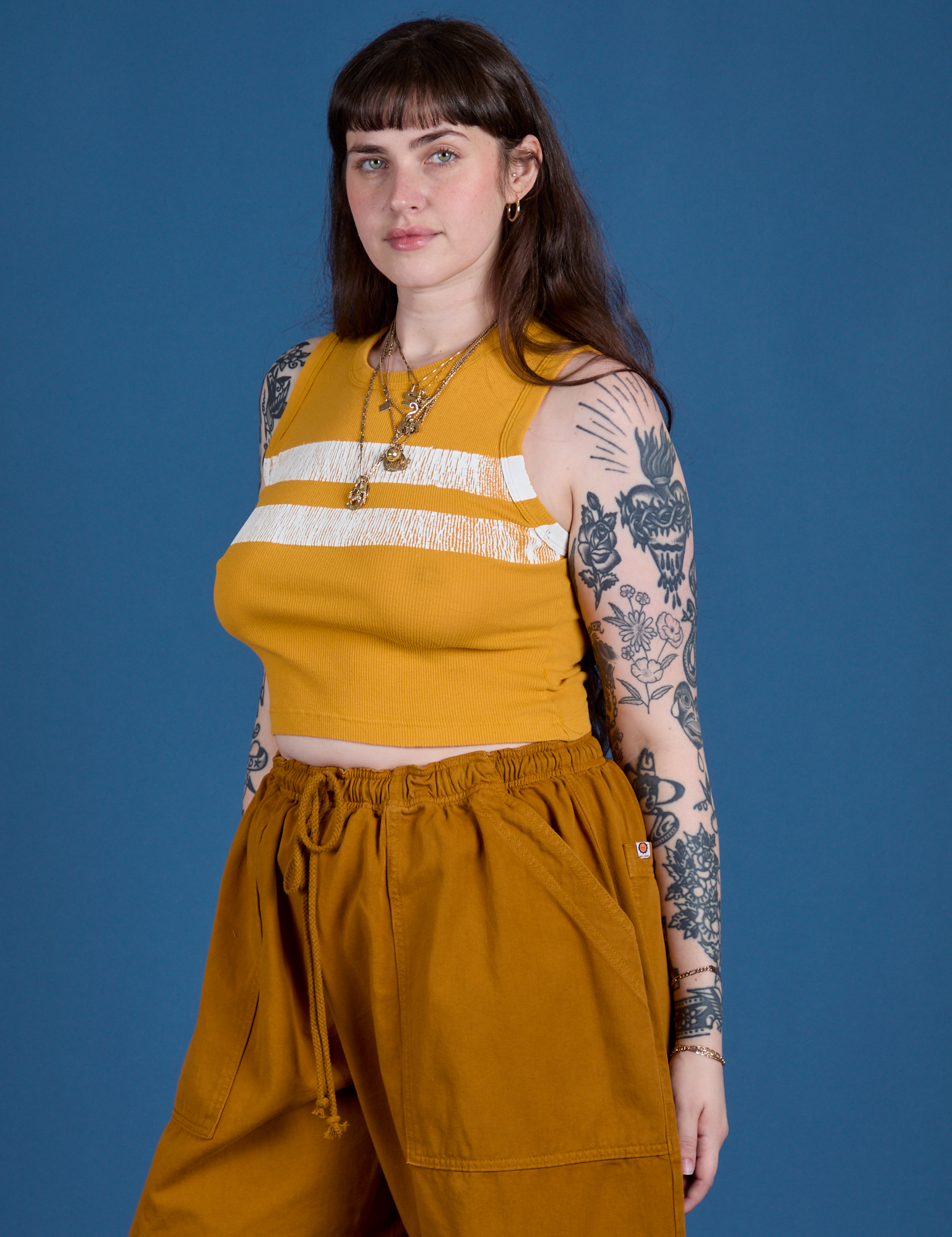 Painted Muscle Tee in Mustard Yellow angled front view on Sydney