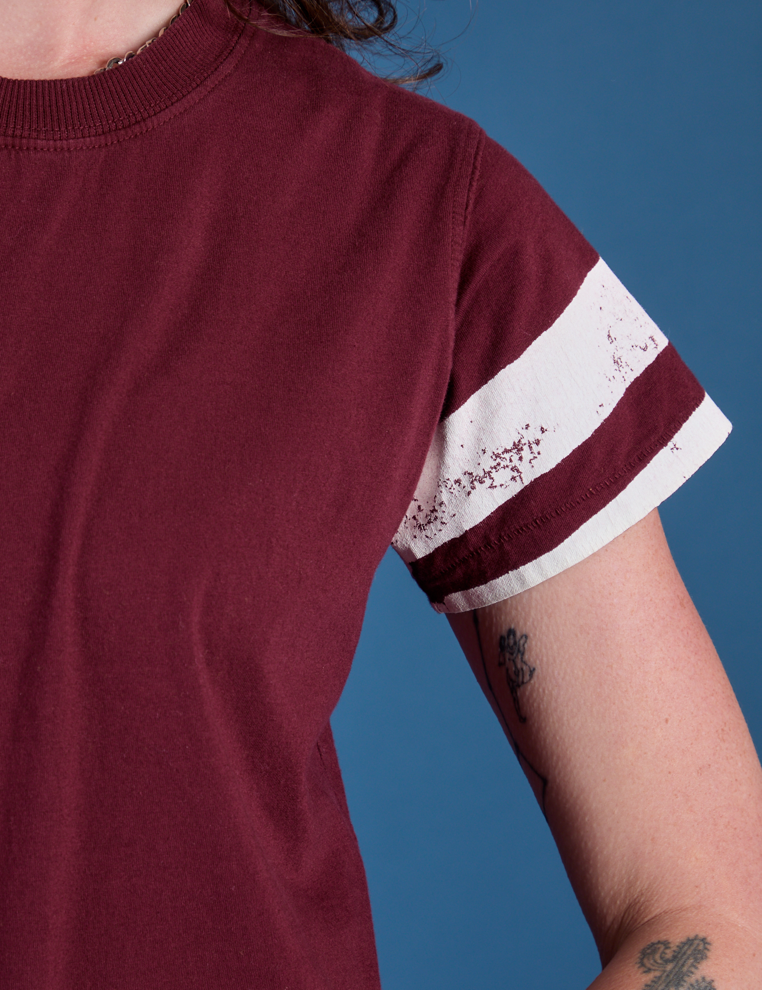 Painted Vintage Tee in Red Wine sleeve close up with two painted white stripes