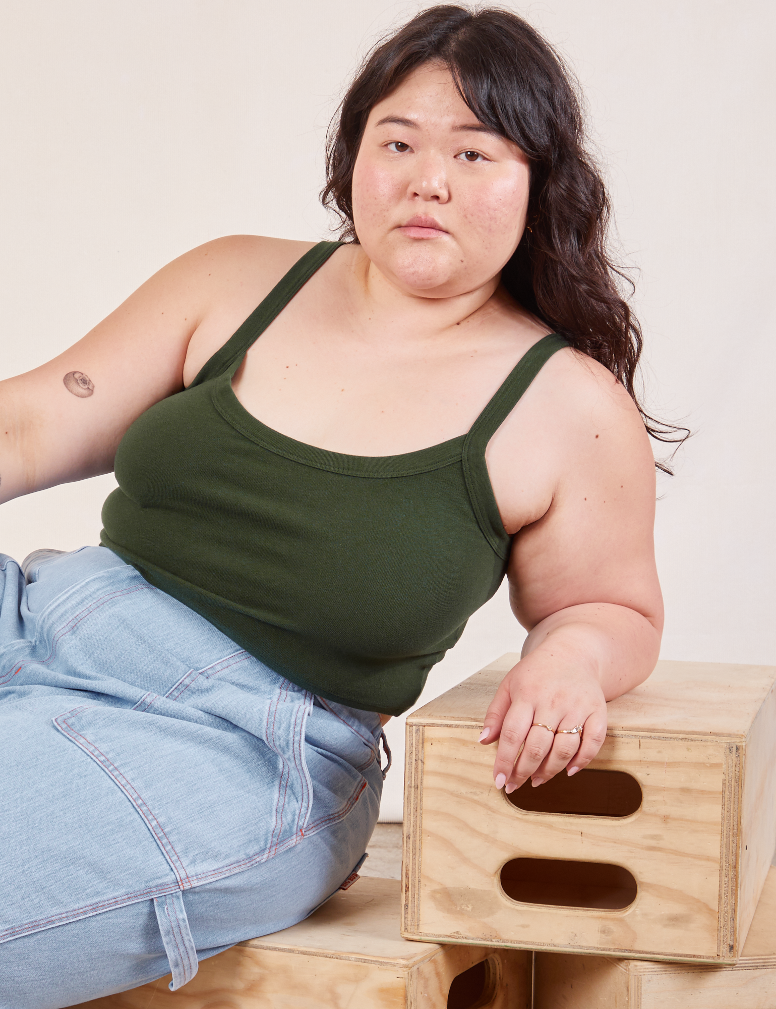 Ashley is wearing Cropped Cami in Swamp Green
