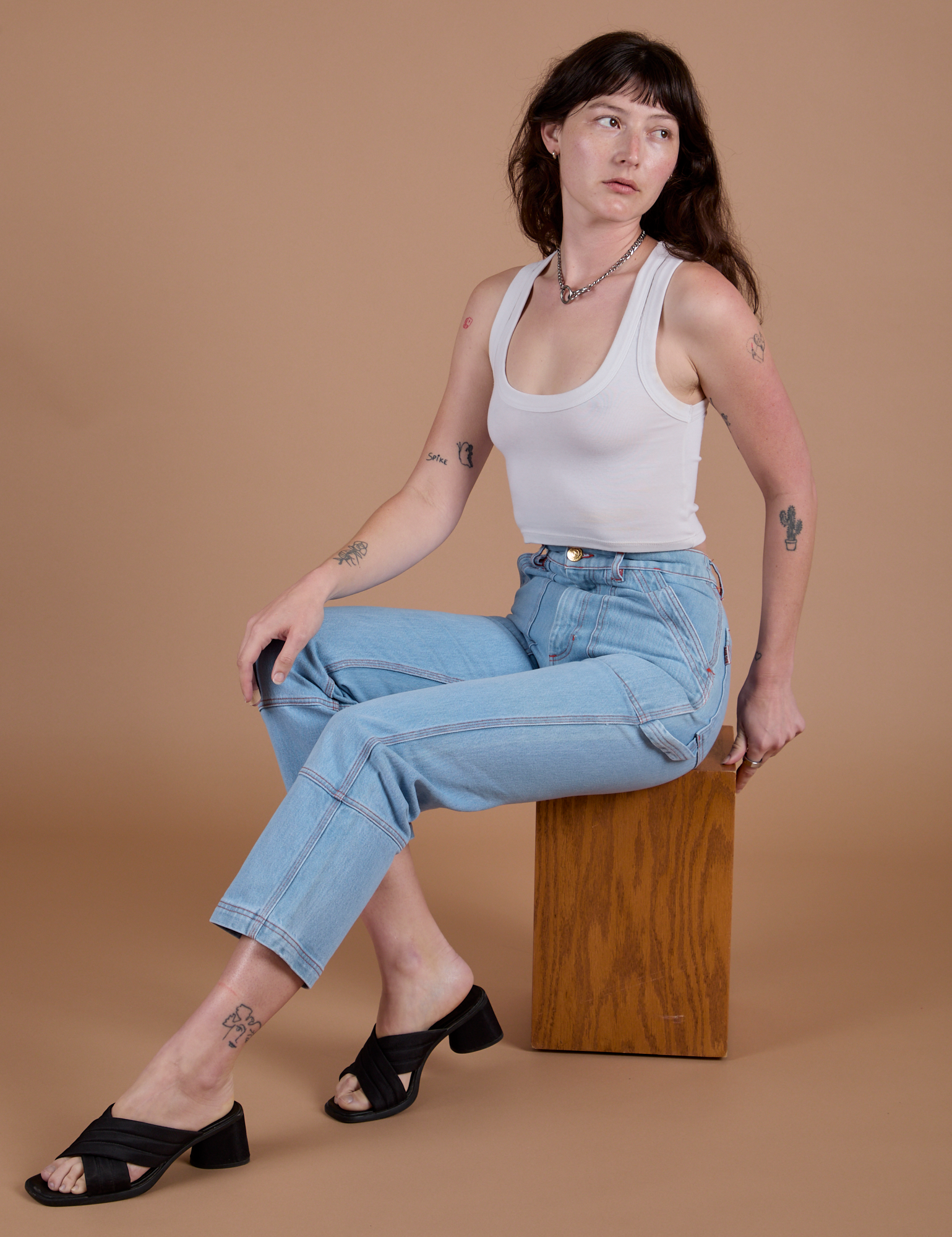 Carpenter Jeans in Light Wash and Cropped Tank in Vintage Tee White on Alex