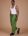 Denim Drop Pocket Pants in Green Overdye angled front view on Isaac
