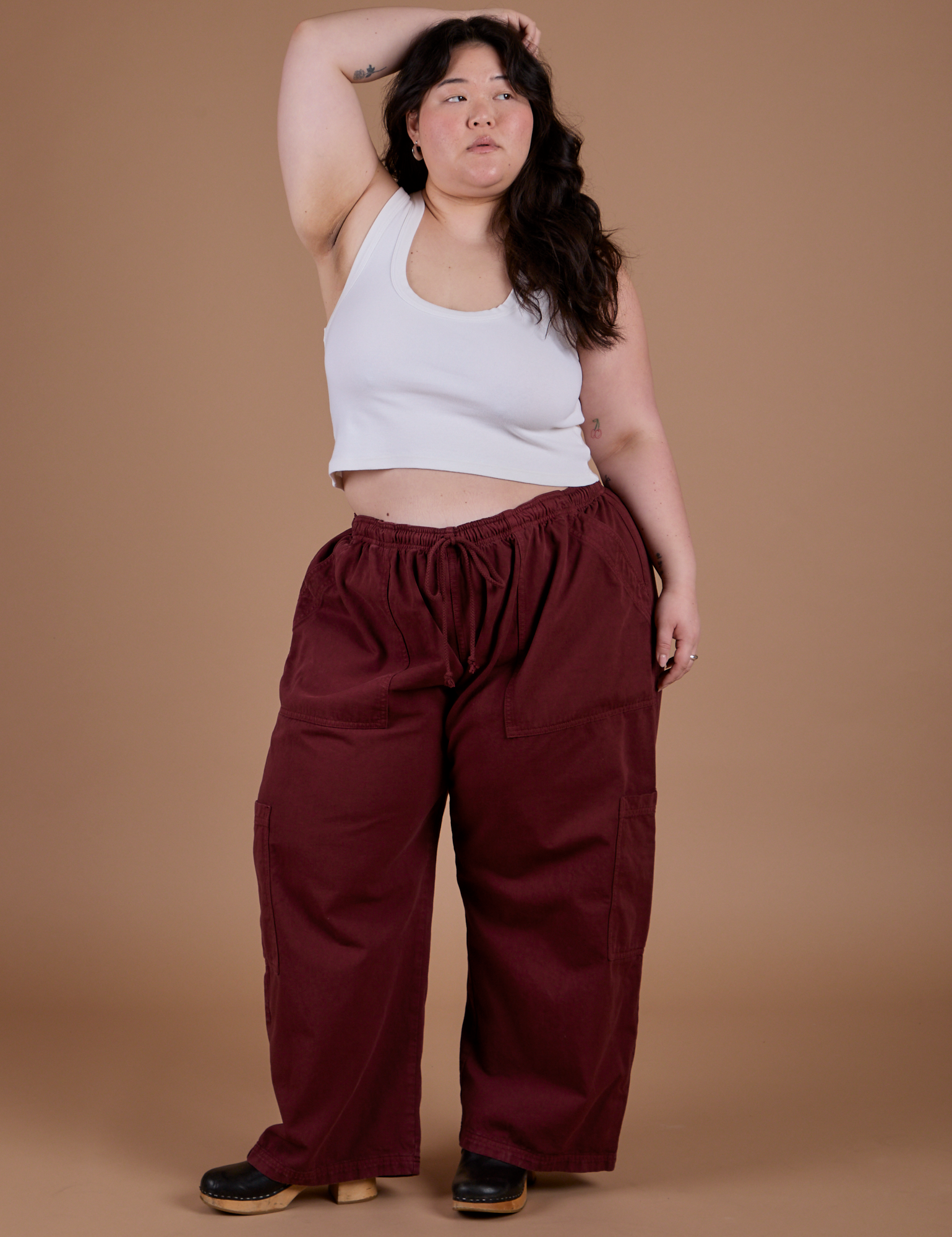 Ashley is wearing Drop Pocket Cargo Pants in Red Wine and Cropped Tank  in Vintage Tee White