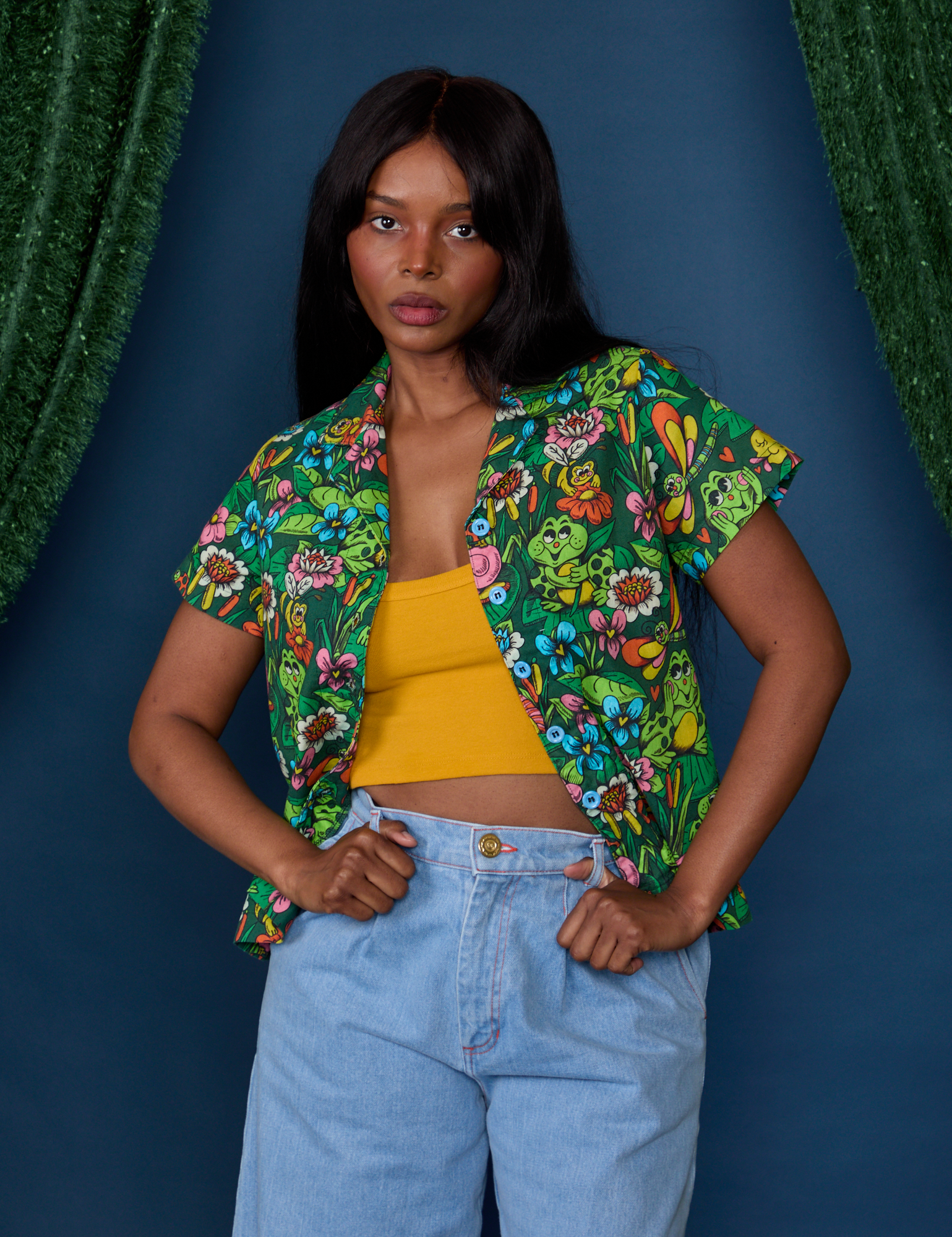 Kandia is 5'3" and wearing P Pond Party Pantry Button-Up
